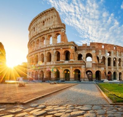 View of Colosseum in Rome and morning sun, Italy, Europe.